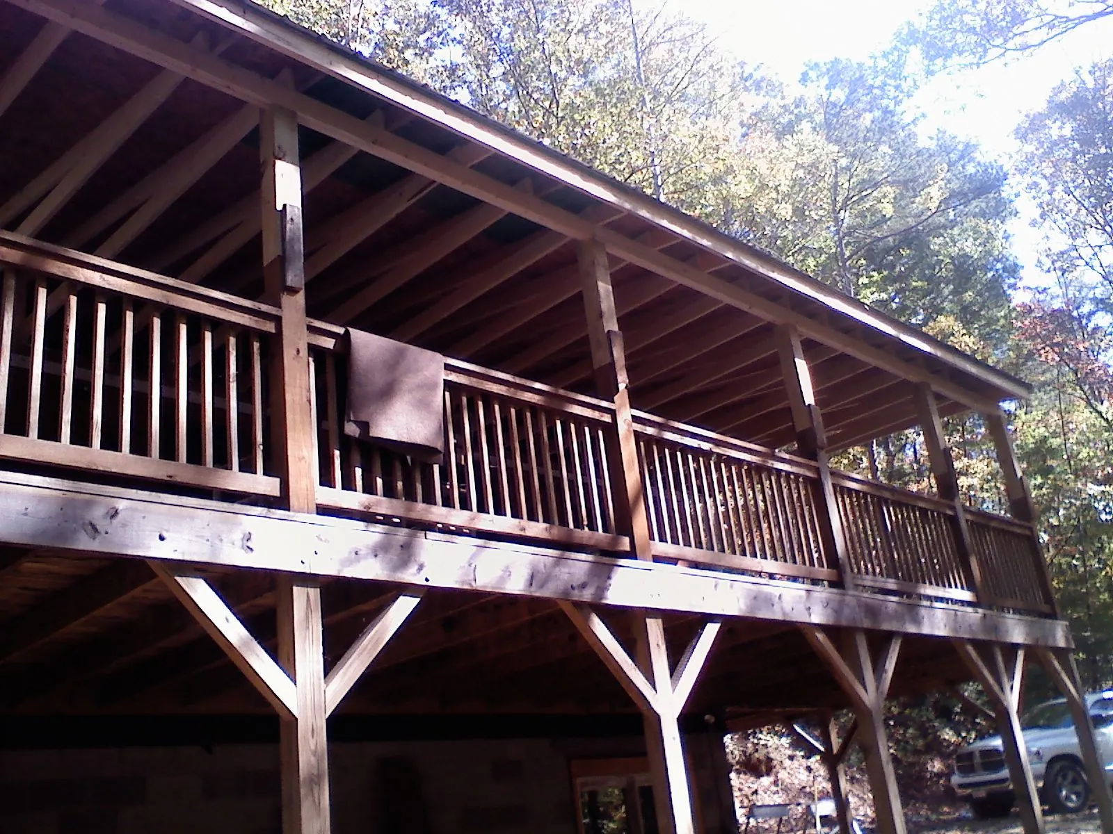 Timber framing under a new elevated porch and deck — Roof Leak Repair in North East by Roofing Brothers